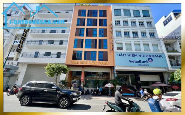 Cho thuê văn phòng mặt tiền Bạch đằng sát sân bay, văn phòng ốp kính thoáng đã, hầm xe