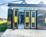Bán căn nhà 1 trệt 1 lầu mới xây,SHR,nằm đối diện cổng KDC Tân Đức,DTSD 150m2,SHR 1ty399